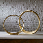 Pair of gold Jimena ring sculptures by Uttermost, decorative sculptures and figurines with modern elegance.