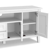 Handcrafted Warm Shaker TV media stand by Simpli-Home with open shelves and storage compartments, made of warm-toned wood