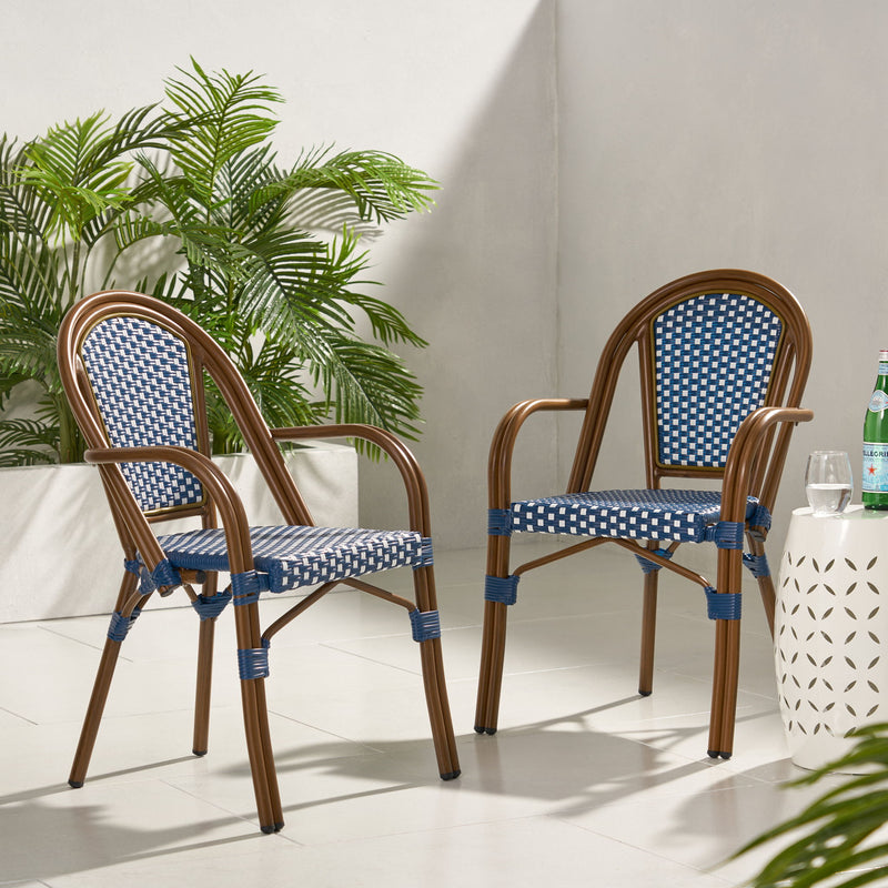 Set of two Noble House bistro chairs with white and navy two-toned checkered fabric seats and white painted wooden frames.