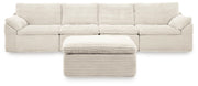Ivory Fannin 4-piece sectional with Ottoman from Signature Design by Ashley, featuring plush cushions and modern design.