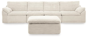 Ivory Fannin 4-piece sectional with Ottoman from Signature Design by Ashley, featuring plush cushions and modern design.