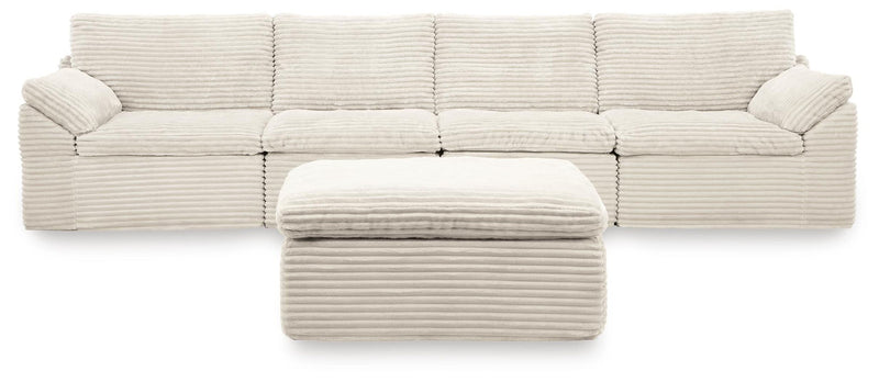 Ivory Fannin 4-piece sectional with Ottoman from Signature Design by Ashley, featuring plush cushions and modern design.