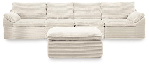 Ivory Fannin 4-piece sectional with Ottoman from Signature Design by Ashley, featuring plush cushions and modern design.