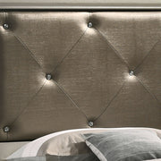 Upholstered bed from Glory Furniture's Lorana collection with a padded headboard and neutral fabric, showcasing a modern bedroom design.
