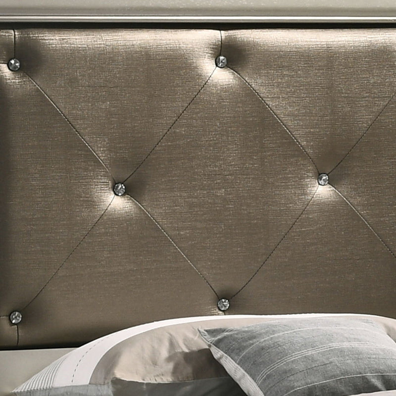Upholstered bed from Glory Furniture's Lorana collection with a padded headboard and neutral fabric, showcasing a modern bedroom design.