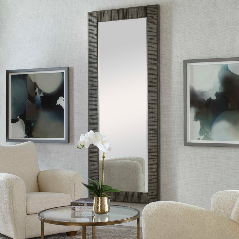 Gray Figaro oversized accent mirror by Uttermost featuring a bold, decorative frame with intricate detailing.