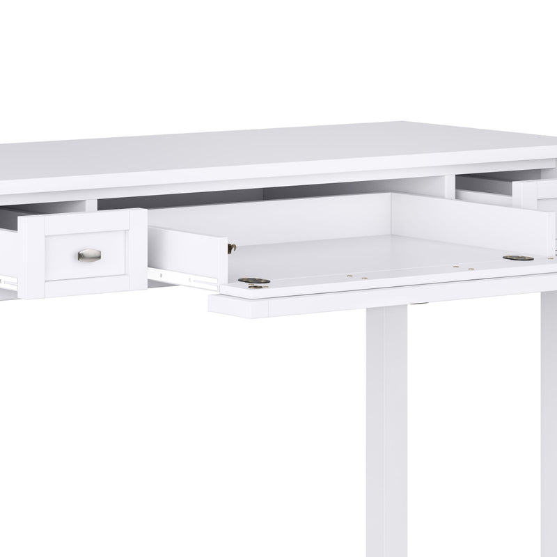 Handcrafted Warm Shaker writing desk from Simpli-Home with a natural wood finish and spacious tabletop for home office use.
