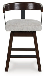 Haddigan - Upholstered Swivel Barstool (Set of 2) - Dark Brown - R&R Furniture Gallery (Fountain Valley, CA)
