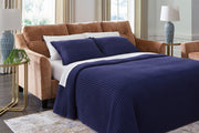 Benchcraft® Amity Bay sofa chaise sleeper with plush fabric, featuring a convertible design and comfortable seating.