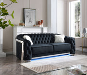 Glory Furniture sapphire-colored stationary sofa with plush cushions and modern design in a living room setting.