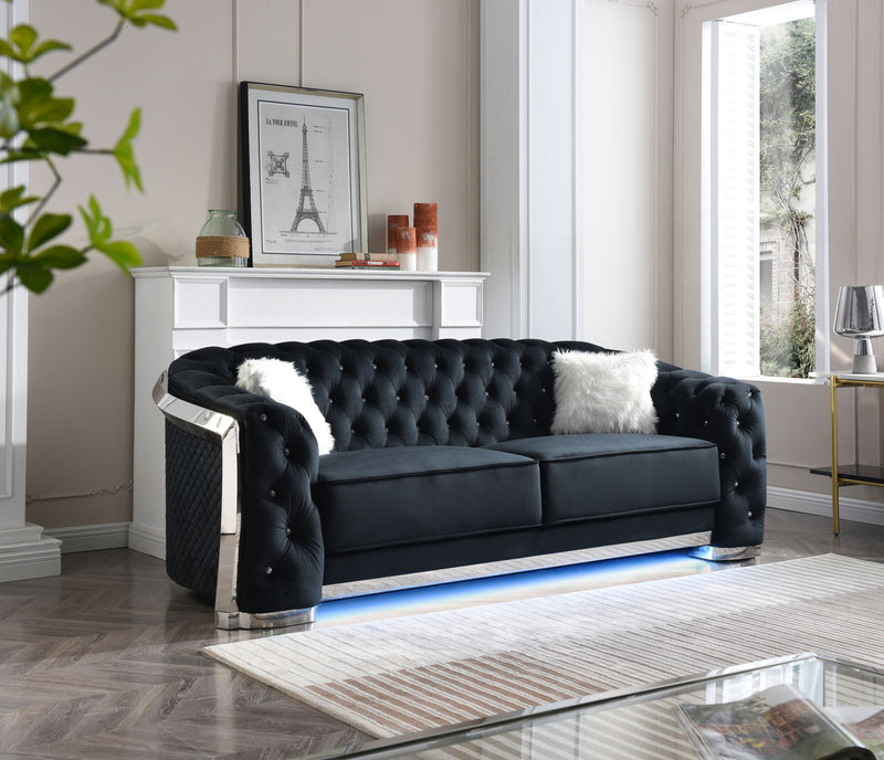 Glory Furniture sapphire-colored stationary sofa with plush cushions and modern design in a living room setting.
