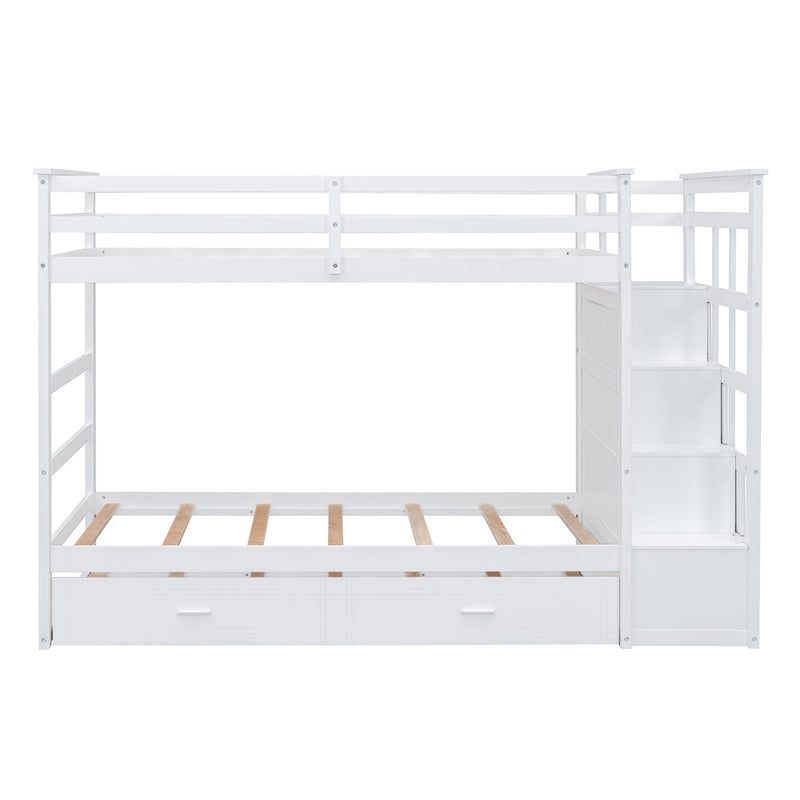 DreamHaus white twin over twin bunk bed with staircase and trundle, featuring a sturdy frame and safety railings.