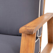 Noble House outdoor patio lounge arm chair with cushioned seat and backrest, ideal for outdoor relaxation and seating.