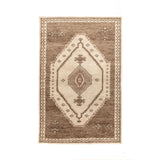 Hand-knotted Luxor area rug by Classic Home featuring intricate patterns and rich colors, perfect for adding elegance to a living space.