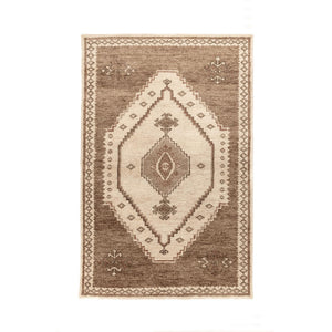 Hand-knotted Luxor area rug by Classic Home featuring intricate patterns and rich colors, perfect for adding elegance to a living space.