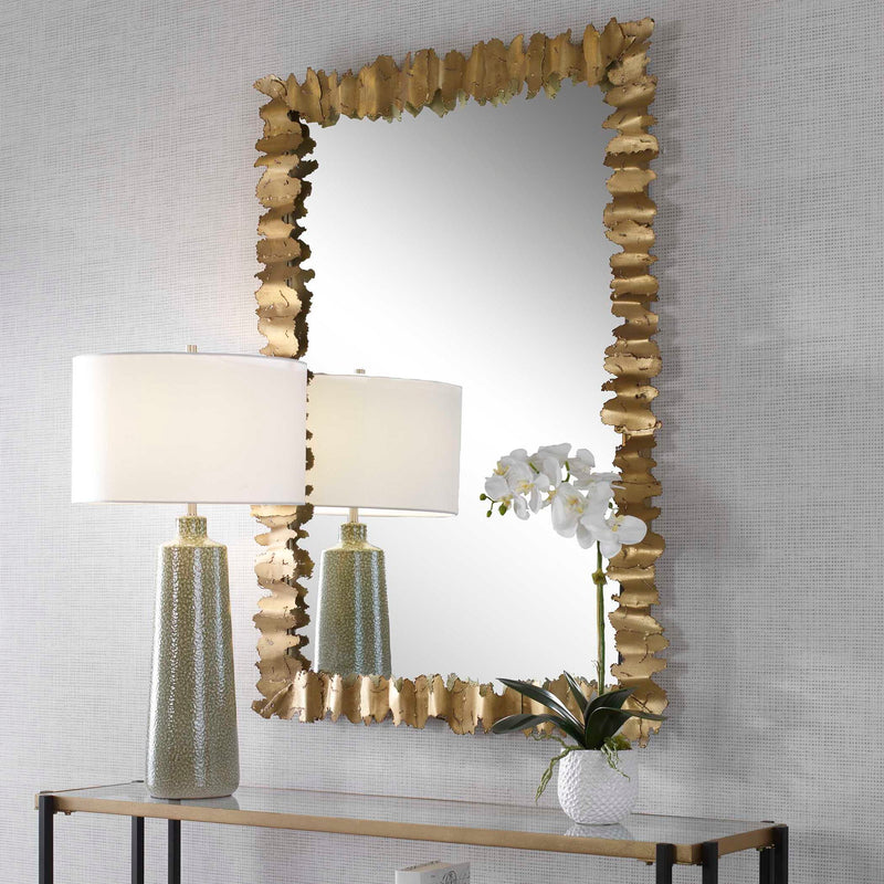 Gold Lev accent mirror by Uttermost featuring a round shape with a sleek, modern design for stylish wall decor.