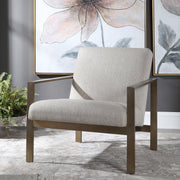 Contemporary beige armchair by Uttermost with sleek design and plush upholstery for stylish living room seating.