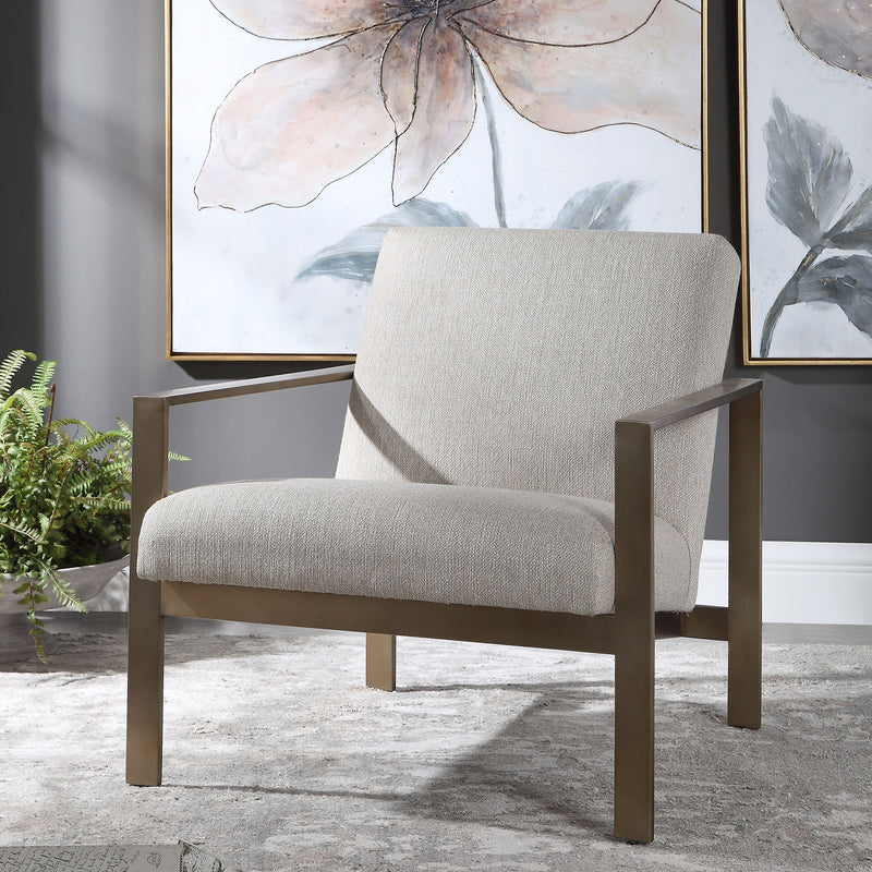Contemporary beige armchair by Uttermost with sleek design and plush upholstery for stylish living room seating.