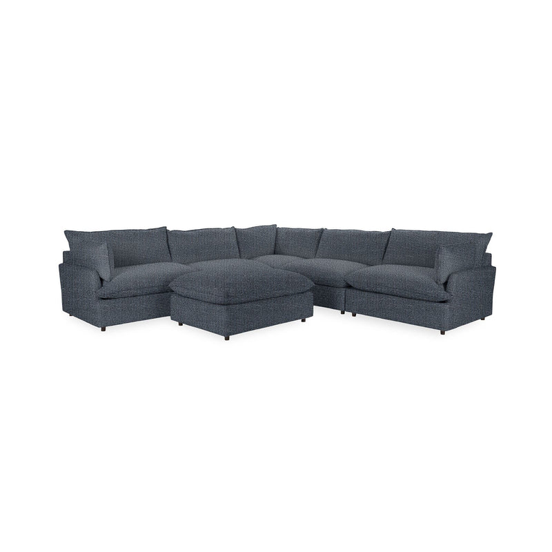 Classic Home Caplan 6-piece modular sectional with ottoman in neutral fabric, arranged for a modern living room setting.