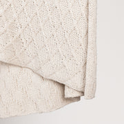 Ivory Catalina throw blanket by Classic Home, soft and cozy throw for sofa or bed, featuring a plush fabric texture.