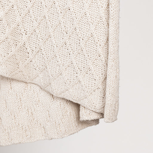 Ivory Catalina throw blanket by Classic Home, soft and cozy throw for sofa or bed, featuring a plush fabric texture.