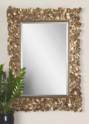 Uttermost Capulin wall mirror with antique gold finish, round shape and decorative frame for elegant wall decor.