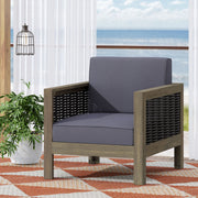 Outdoor acacia wood club arm chair with wicker accents from Noble House, featuring a sturdy frame and comfortable seating.