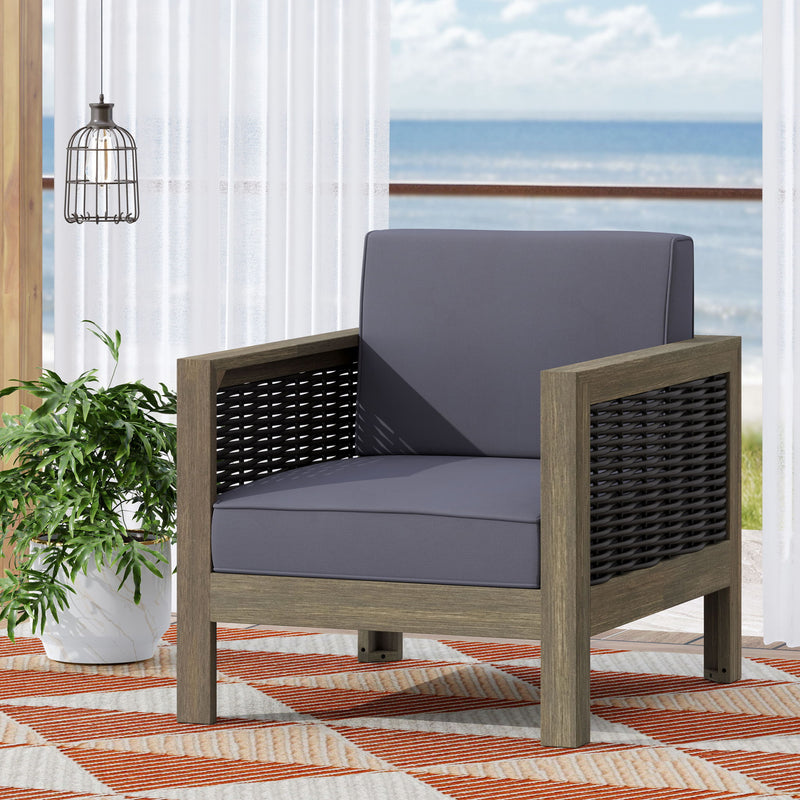 Outdoor acacia wood club arm chair with wicker accents from Noble House, featuring a sturdy frame and comfortable seating.