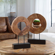 Pair of Uttermost Ashlea wooden sculptures in light brown and black, featuring modern abstract figurine designs.