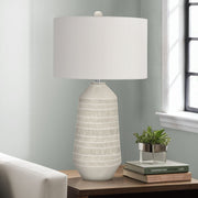 Cream ceramic contemporary table lamp by 8th Street with a sleek, modern design suitable for living rooms or bedrooms.