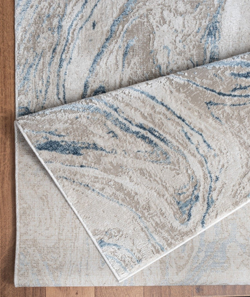 Elegance - 5'3" X 7'3" Polyester Area Rug - Ivory - R&R Furniture Gallery (Fountain Valley, CA)