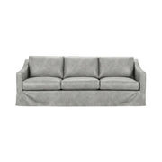 Classic Home Kipton upholstered stationary sofa with plush fabric and cushioned backrest, shown in a cozy living room setting.