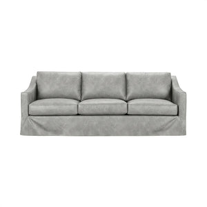 Classic Home Kipton upholstered stationary sofa with plush fabric and cushioned backrest, shown in a cozy living room setting.