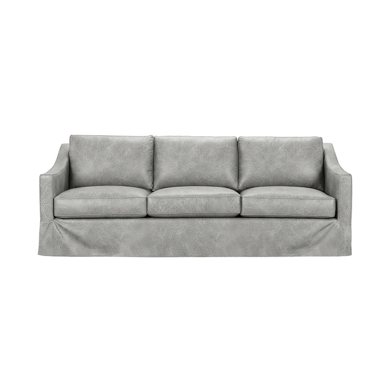 Classic Home Kipton upholstered stationary sofa with plush fabric and cushioned backrest, shown in a cozy living room setting.