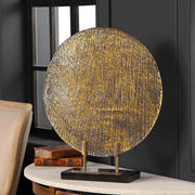 Uttermost Layan Art Glass Charger sculpture with a gold finish, featuring a sleek, artistic design perfect for decorative display.