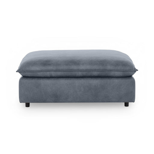 Classic Home Caplan upholstered ottoman with cushioned top and wooden legs, versatile accent piece for living rooms.