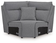 Signature Design by Ashley Modmax II reclining sectional in salt and pepper fabric, showing the sectional’s plush cushions and reclining feature.