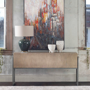 Uttermost Nevis contemporary console table in light brown wood with sleek design and clean lines.
