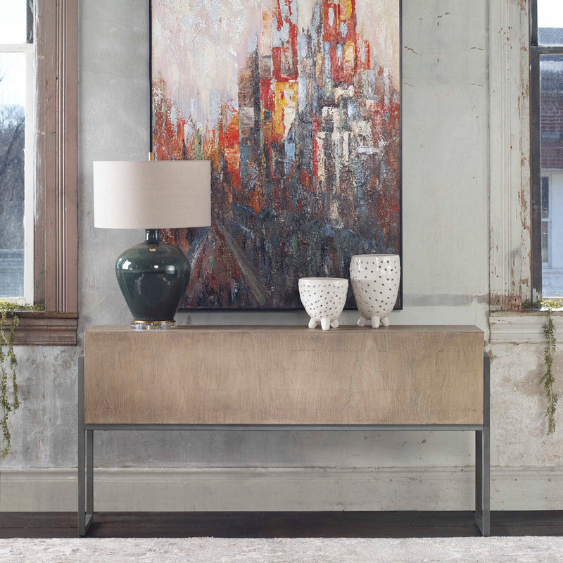 Uttermost Nevis contemporary console table in light brown wood with sleek design and clean lines.