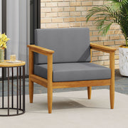 Noble House outdoor club arm chair with dark gray cushions and teak acacia wood frame, perfect for patio or garden seating.