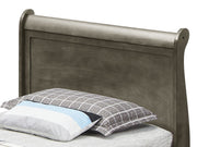 Elegant Glory Furniture trundle bed with a classic design, featuring a wooden frame and a pull-out bed for versatile sleeping options.