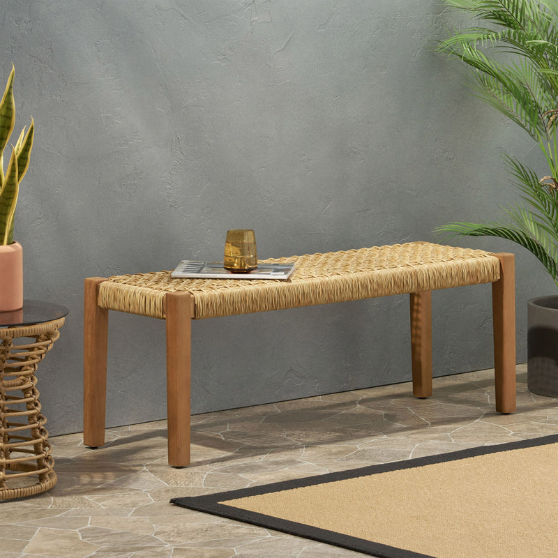 Angie outdoor bench by Noble House with acacia wood frame and faux rattan seating, featuring a teak finish.