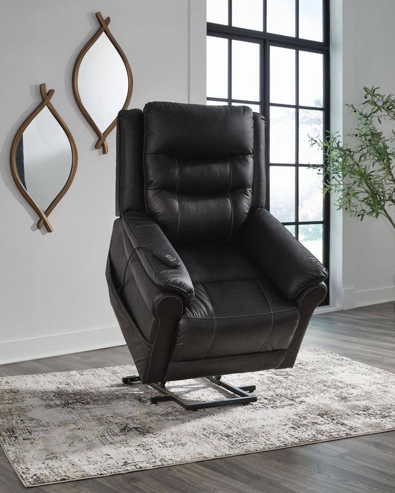 Signature Design by Ashley Oatman Power Lift Recliner in plush fabric with padded armrests and a sturdy lift mechanism.