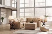 Signature Design by Ashley Bandon 3-piece living room set with sofa, loveseat, and armchair in a modern living space.