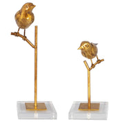 Set of two light brown bird sculptures from Uttermost, detailed passerine bird figurines for home decor.