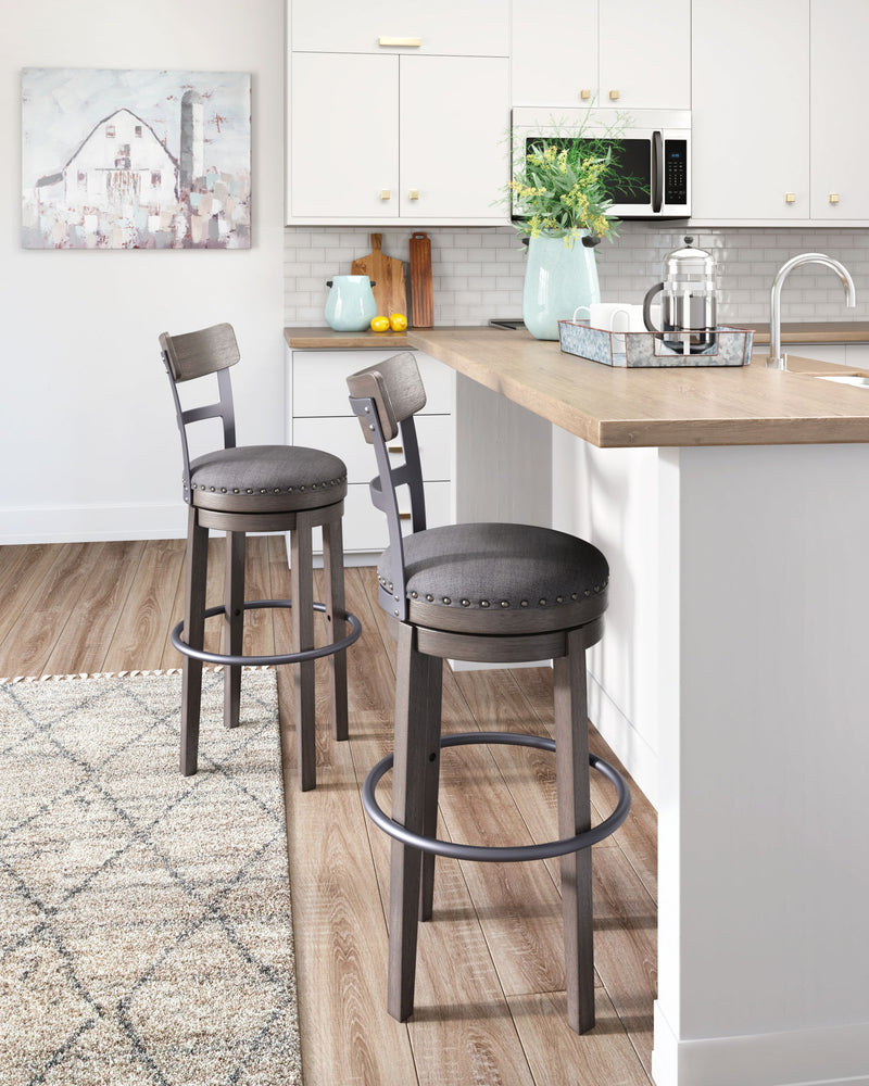 Caitbrook - Tall UPH Swivel Barstool - Gray - R&R Furniture Gallery (Fountain Valley, CA)