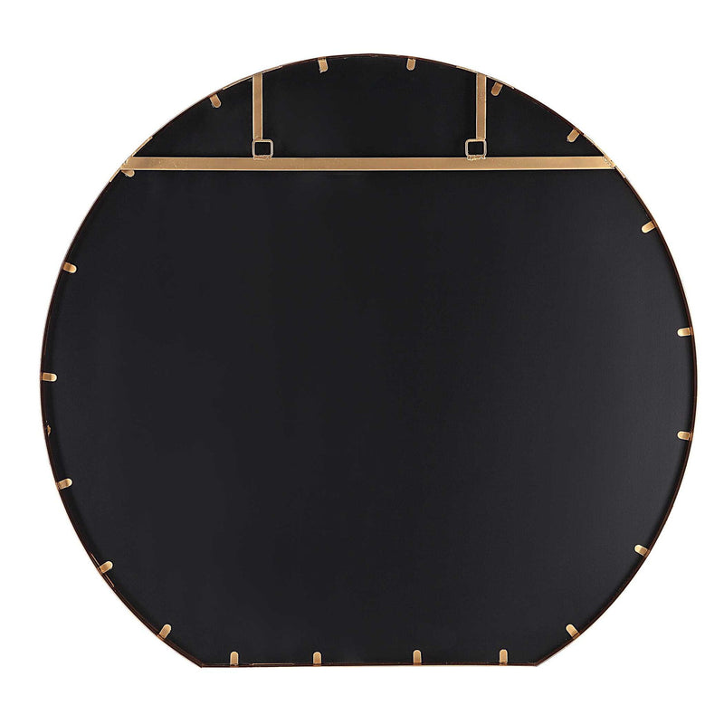 Uttermost Cabell wall mirror with a sleek frame, hanging on a wall, showcasing modern design and reflective glass.