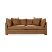 Classic Home Audrey stationary sofa with plush fabric upholstery and elegant design, shown in a cozy living room setting.