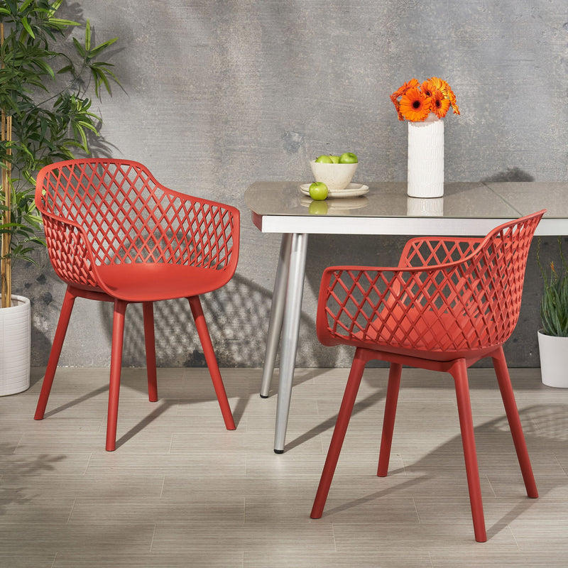 Set of two Noble House Poppy chairs with cushioned seats and wooden legs, featuring a modern design for dining or living spaces.