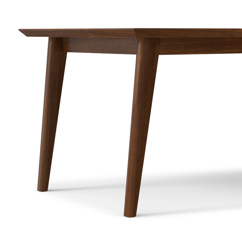 Rectangular dining table by Simpli-Home with wooden top and sturdy legs, ideal for family meals and gatherings.